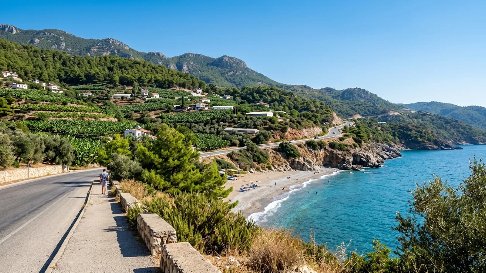 Scenic Yeşilöz coast east of Alanya A quiet beach in Yeşilöz below the coast road, with banana plantations and wooded hills behind.
